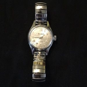 Small silver retractable band watch